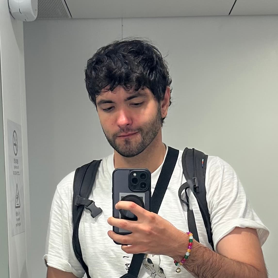 David Podolskyi taking a mirror selfie